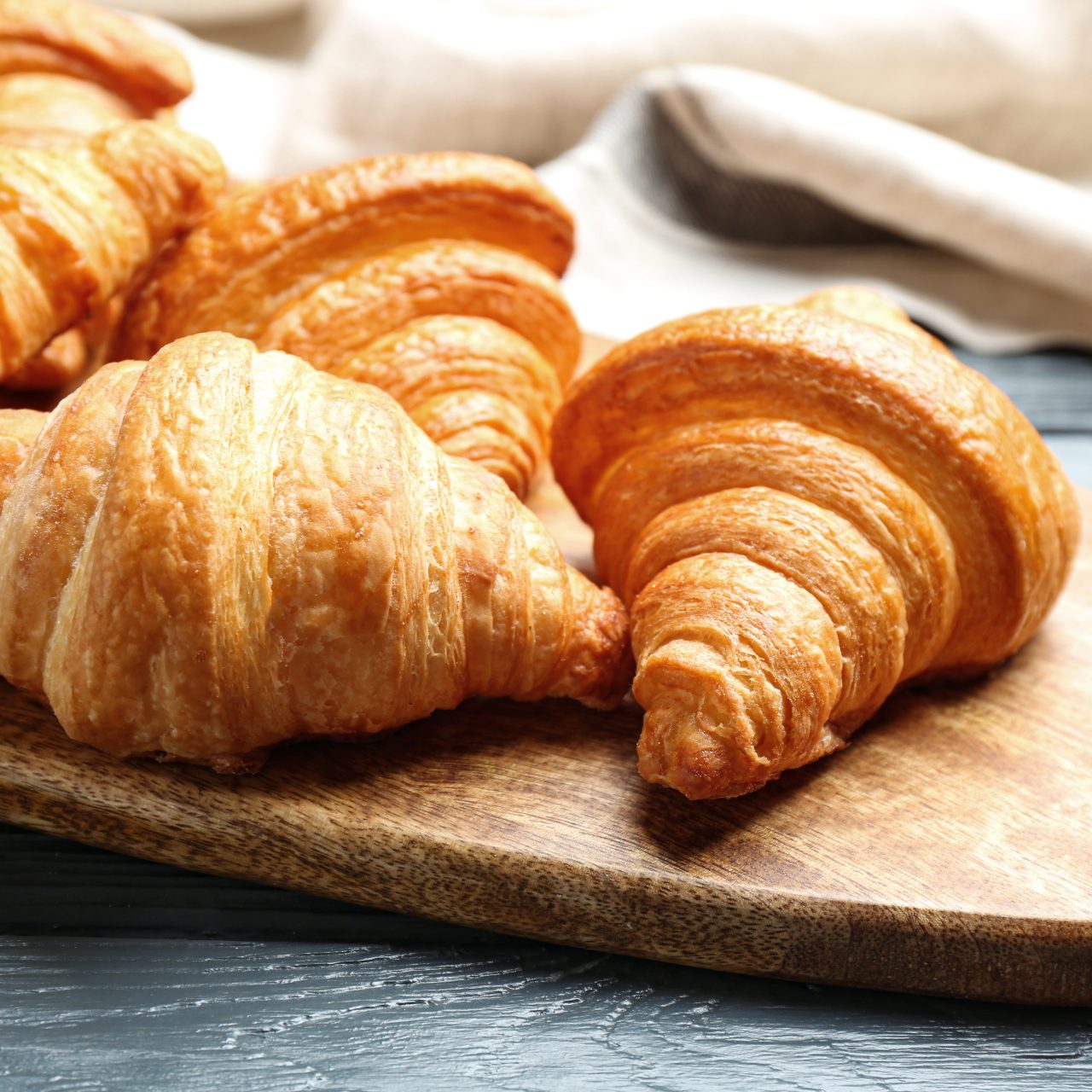 Board,With,Tasty,Croissants,On,Dark,Wooden,Table,,Closeup.,French