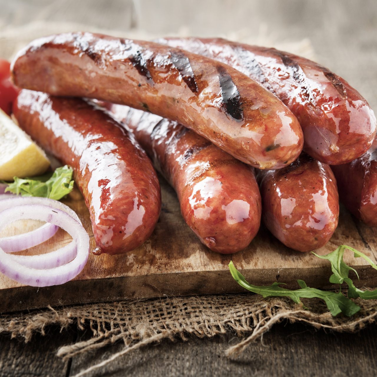 Delicious,Grilled,Village,Sausages,On,Wooden,Surface